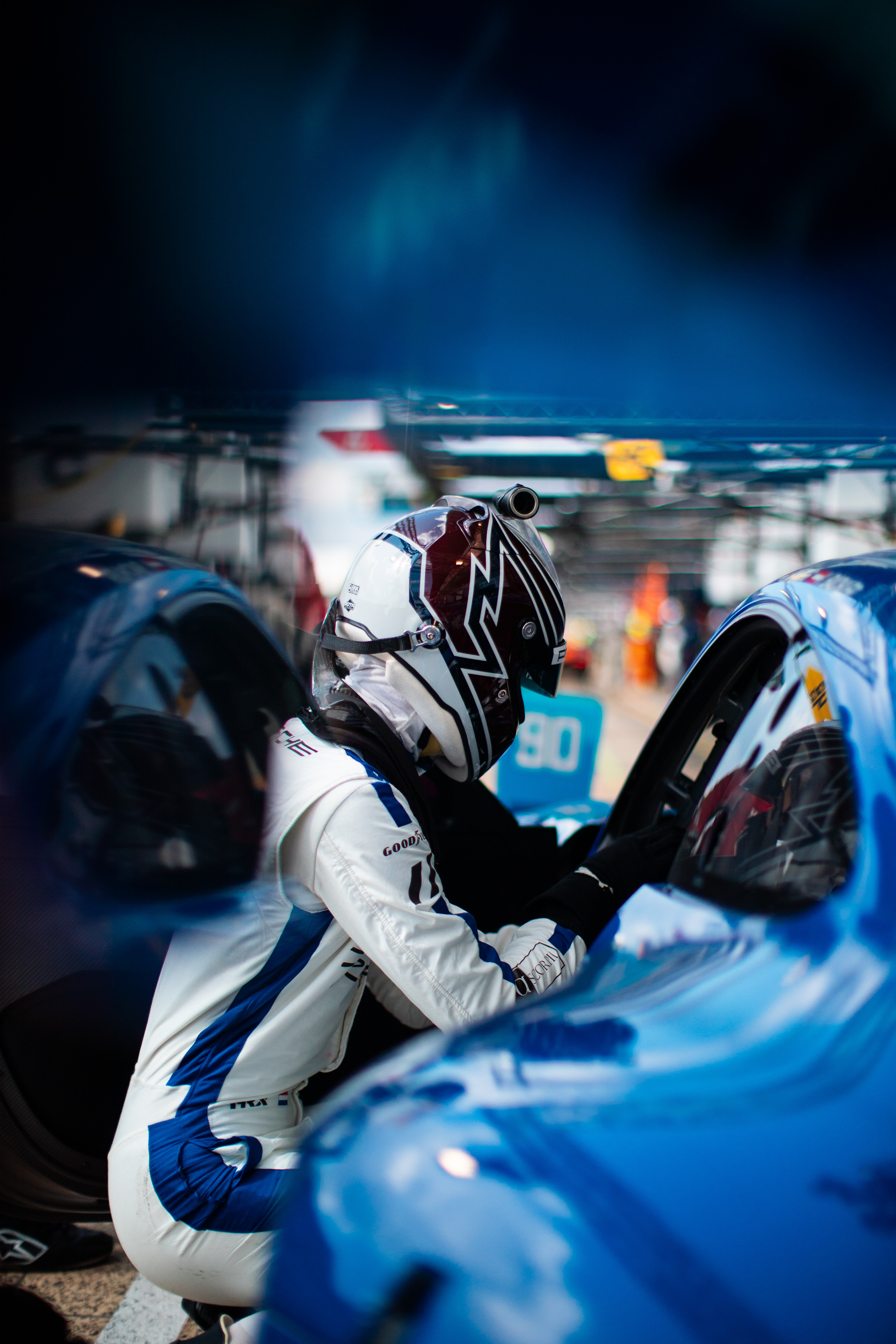 Racing driver stepping into a GT car